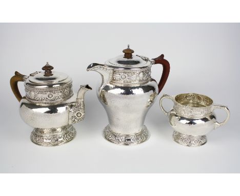 A fine quality George V silver matched three piece part tea and coffee service, the teapot and twin handled sucrier by Ackroy