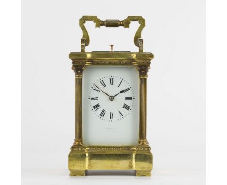 A French brass repeating carriage clock, with Corinthian column case, white Roman enamel dial, retailed by J. Balshaw & Sons,