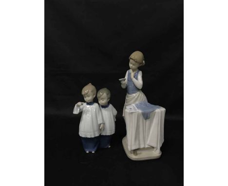 LLADRO FIGURE OF A GIRL IRONING along with a Nao figure of a girl and a Nao figure of two altar boys 