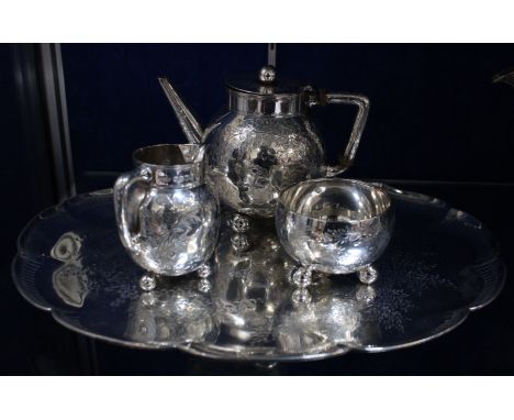 A Victorian silver spherical three piece tea service and tray by Johnson, Walker, & Tolhurst, London 1878, the tea pot with a