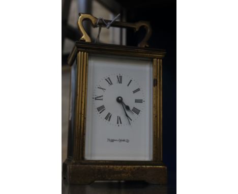 A carriage clock by Mappin & Webb, 11cm high, (14.5cm high including handle)
