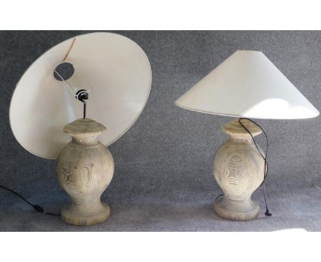 A pair of turned driftwood table lamps and shades. (One lamp has its light fixing broken) H.78cm