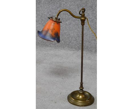 An antique brass lamp with art glass shade. Shade signed. H.47cm 