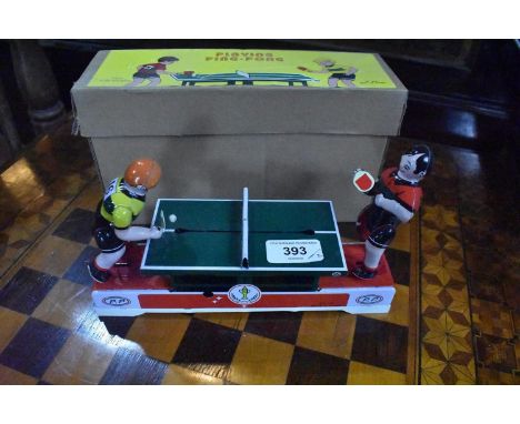 A modern playing ping-pong tinplate game, boxed,  and a dart board 