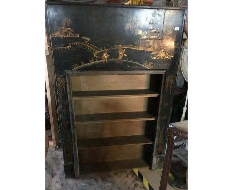 A 1920s black lacquered fire surround, with Chinnoiserie style decoration, made in to a bookcase, 103 cm wide x 158 cm high 