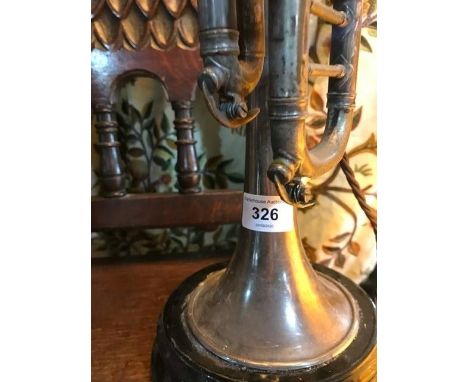 A silvered trumpet, made in to a table lamp, 76 cm high over shade 