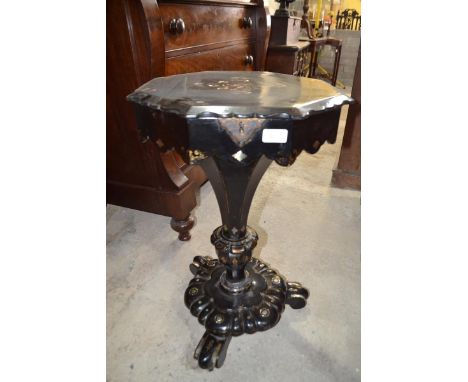 A Victorian papier mache octagonal work table, with gilt and mother of pearl decoration, 47 cm wide 