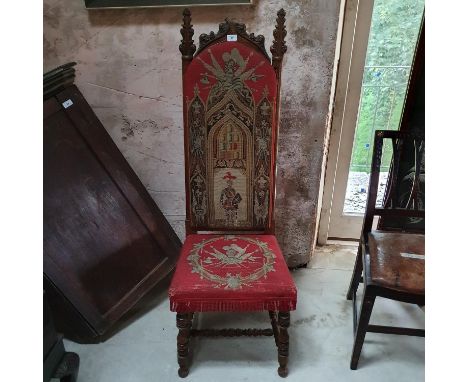 A Victorian Gothic walnut prie dieu chair, with needlework upholstery, wormed, lacks finial 