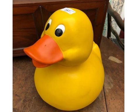 A composition duck, 34 cm high, three orange and yellow enamel light shades, 24 cm high, and a pair of pottery dogs 