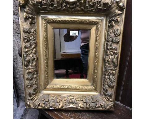 A pair of brass vase shaped lamps, 40 cm high over fitments, a pottery lamp, and a wall mirror (4) 