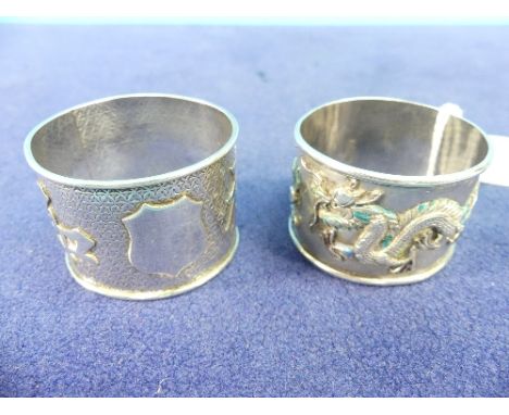 Two Chinese silver Napkin Rings; one with enamelled scrolling dragons and pearl, enamel in very poor condition, Chinese chara