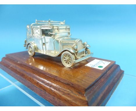 A contemporary silver model of a Vintage Taxi, makers mark R&amp;H, hallmarked London,1996, the model depicting a 1930's era 