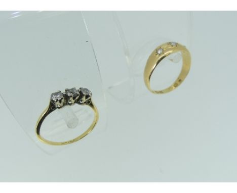 An 18ct yellow gold Ring, the flared front gypsy set wioth three diamonds, Size K½, together with a small three stone dimaond