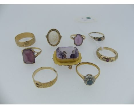 A 9ct yellow gold Ring, gypsy set central small ruby with a diamond on either side, with textured shank, size N, together wit