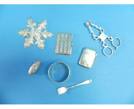 An American silver novelty Christmas Decoration, by Gorham silver, marked Christmas 1997, in the form of a snowflake, togethe