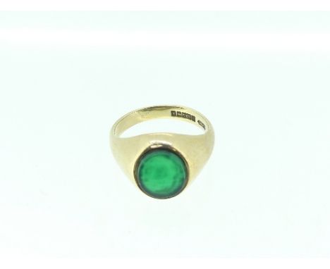 A 9ct yellow gold Signet Ring, set in the centre with an oval green jade, total weight 7.4g, Size S. 