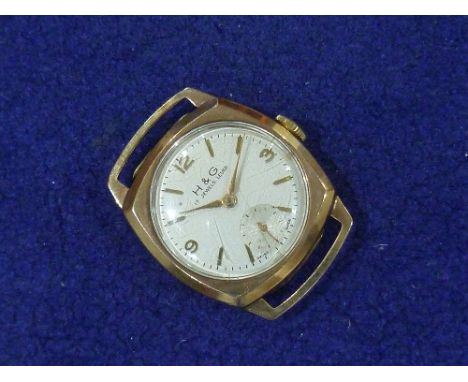 H &amp; G: A gentleman's 9ct gold Wristwatch, with 17-jewels lever movement, the cushion case with circular silvered dial, Ar