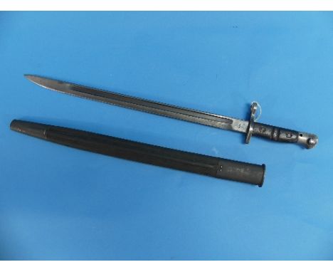 A WWI 1918 Remington Bayonet, with leather and metal scabbard, the bayonet stamped with the Eagle head &amp; ordnance grenade