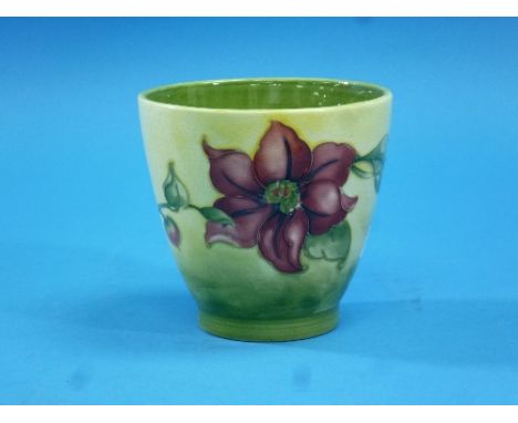 A Moorcroft pottery 'Clematis' pattern planter, of small size, decorated in colours on a pale green ground, impressed mark, s