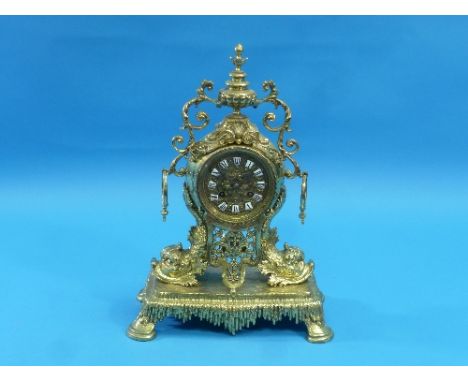 A French Louis XVI-style gilt brass Mantel Clock, with 8-day movement striking on a bell, the moulded dial with enamel hour m