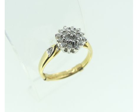 A small 18ct gold and diamond set cluster Ring, Size K with ring sizer.