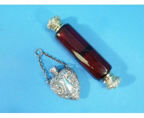 A 19thC ruby glass double ended Scent Bottle, one screw fitting silver gilt end, the other hinged with glass stopper, silver 