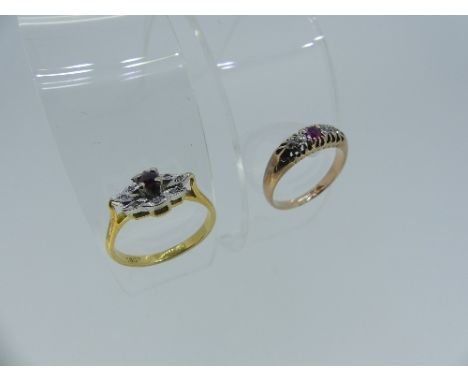 A small ruby and diamond Ring, the central pale ruby set with eight petals around, each with a small diamond, marked in the s