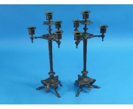 A pair of early 20thC French four-light Candelabra, of reeded column form on tripod bases, the legs modelled as goals legs, 1