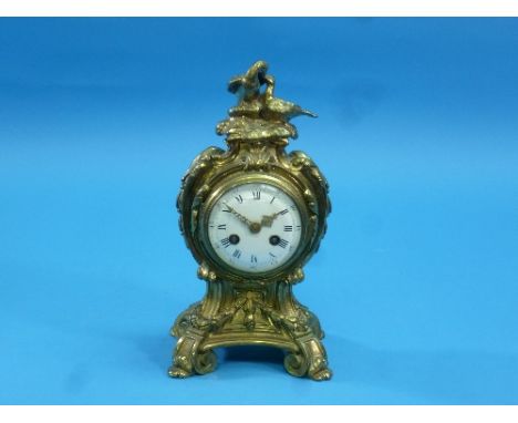 A Louis XVI-style gilt brass Mantel Clock, with 8-day movement striking on a bell, the white enamel dial with black Roman num