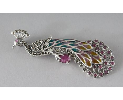 A SILVER, RUBY, PLIQUE ENAMEL PEACOCK BROOCH.