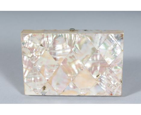 A GOOD VICTORIAN MOTHER-OF-PEARL PURSE with blue interior. 4ins x 2.75ins.