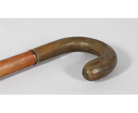 A RHINO HANDLE WALKING STICK. 35ins long.