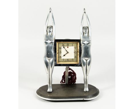 AN ART DECO CHROME PLATED ELECTRIC MANTLE CLOCK, by Genalex, with a square dial suspended between two standing female nudes. 