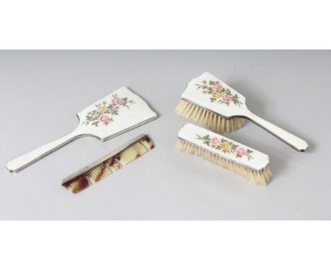 A FOUR PIECE SILVER AND ENAMEL DRESSING TABLE SET, mirror, two brushes and comb. Birmingham 1941.
