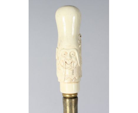 A CARVED BONE CHINAMAN HANDLE WALKING STICK. 36ins long.