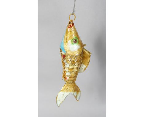 AN ENAMEL FISH PENDANT. 3.5ins long.