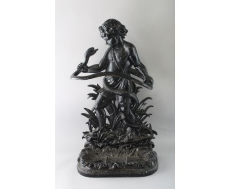 A LATE VICTORIAN CAST IRON STICK STAND, modelled as a young boy holding a snake. 2ft 8ins high x 1ft 6ins wide.