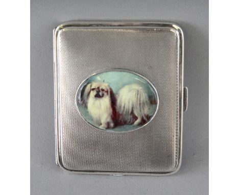 AN ENGINE TURNED SILVER CIGARETTE CASE, Chester 1904, with an oval of a Pekingese dog.