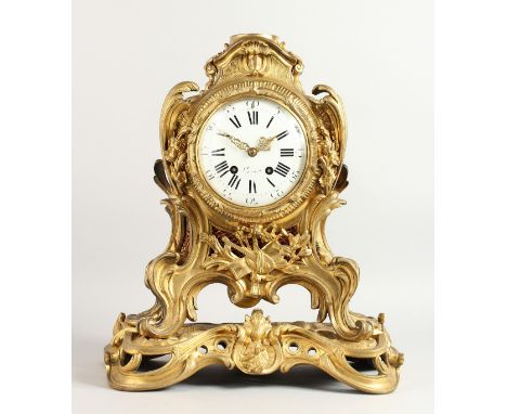 A GOOD 18TH CENTURY FRENCH ORMOLU CLOCK by ROBLIN, PARIS, with black and white enamel dial, in a case with scrolls and musica