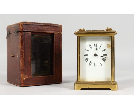 A GOOD FRENCH BRASS CARRIAGE CLOCK. 4.5ins, in a leather case.