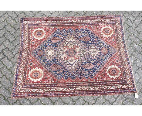 A GOOD SMALL QASHQAI RUG, early 20th century, cream ground central panel, stylised palmette design to each corner within a de