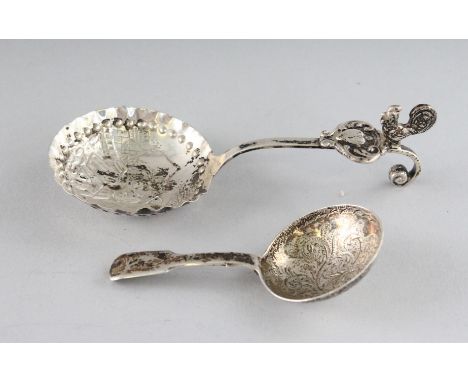 A GEORGE IV SILVER FIDDLE PATTERN CADDY SPOON, Birmingham 1826, and A DUTCH SPOON (2).