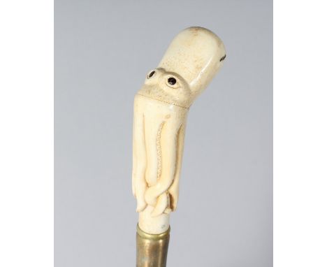 A CARVED BONE OCTOPUS HANDLE WALKING STICK. 35ins long.