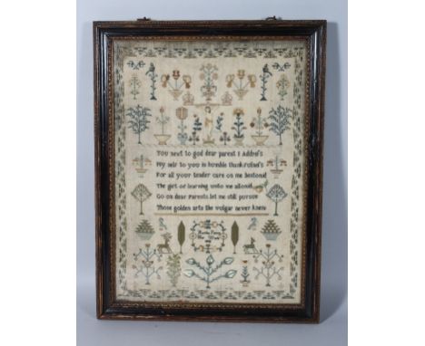A GEORGE III FRAMED SAMPLER, "Martha Perry", her work 1802. 17ins x 12ins.