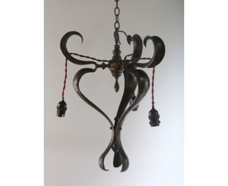 AN ART NOUVEAU HAMMERED CHANDELIER. 18ins.