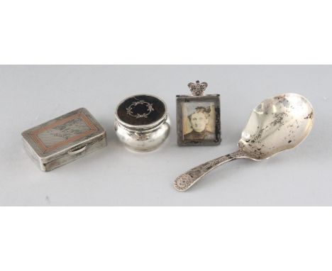 A VICTORIAN BRIGHT CUT SILVER CADDY SPOON, London 1892, an engine turned snuff box, miniature photo frame and tortoiseshell p