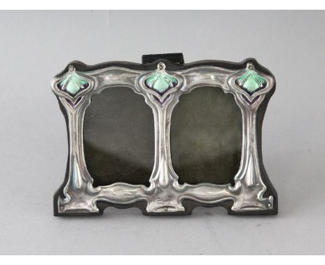 A SMALL SILVER AND ENAMEL DOUBLE FRAME. 3ins x 4.5ins.