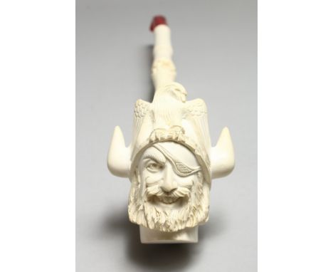 A GOOD LARGE MEERSCHAUM PIPE, the bowl carved as a Viking, in a fitted case. 16ins long.