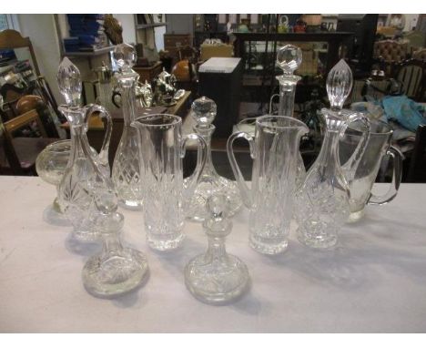 Glassware to include a pair of decanters, a ships decanter, a pair of slender jugs, a pair of baluster jug decanters and othe