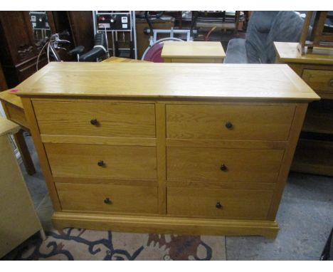 A modern light oak chest of six short drawers, 35 h x 52w